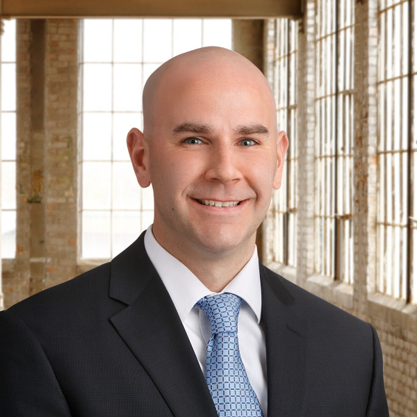 Headshot of Adam Madson, a financial advisor at Nicolet Bank.