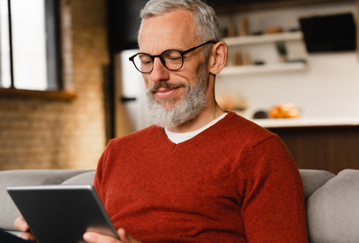 man looking at tablet